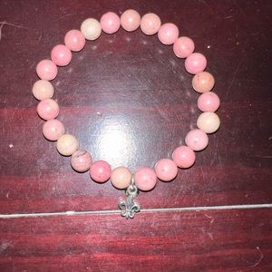 Pink bracelet with charm